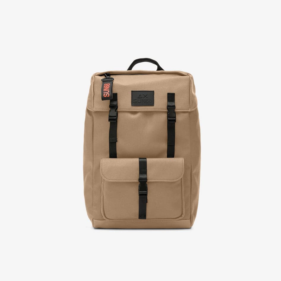 backpack man sand