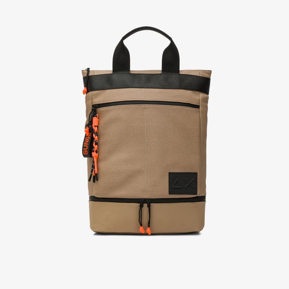 backpack man sand
